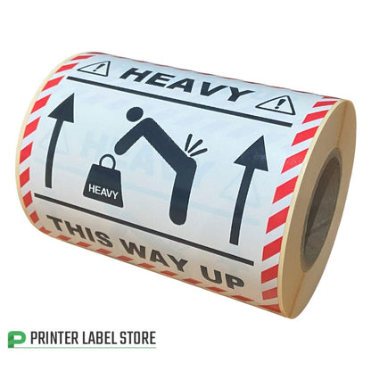 Roll of safety labels with pictograms and text on 'Heavy This Way Up' labels - 100 x 100mm - print black & red